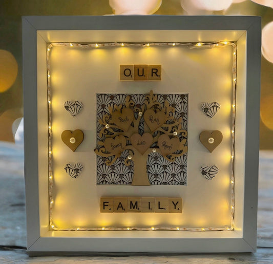 Frame your loved ones with this personalised scrabble frame! Featuring a family tree design and twinkling lights, this frame is sure to brighten up any room. Plus, with the included batteries, you can easily turn the lights on and off. Perfect for a unique and personalized touch to your home decor or a wonderful gift for a loved one for any occasion. 

 